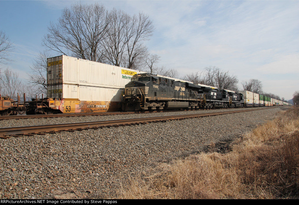 NS 7582 leads a westbound stack train